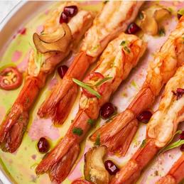 Flambe shrimp with pomegranate dressing